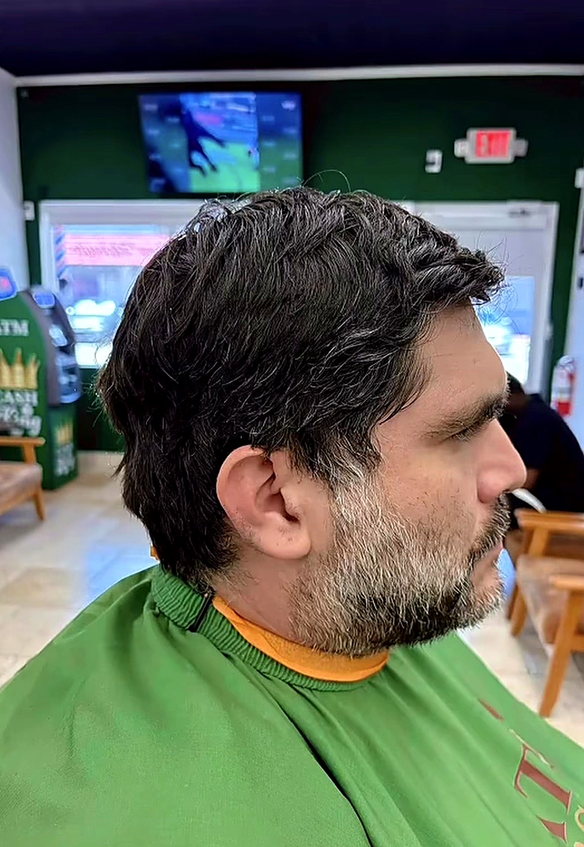 Client's classic scissor cut and shaped beard at Elevation Barbershop