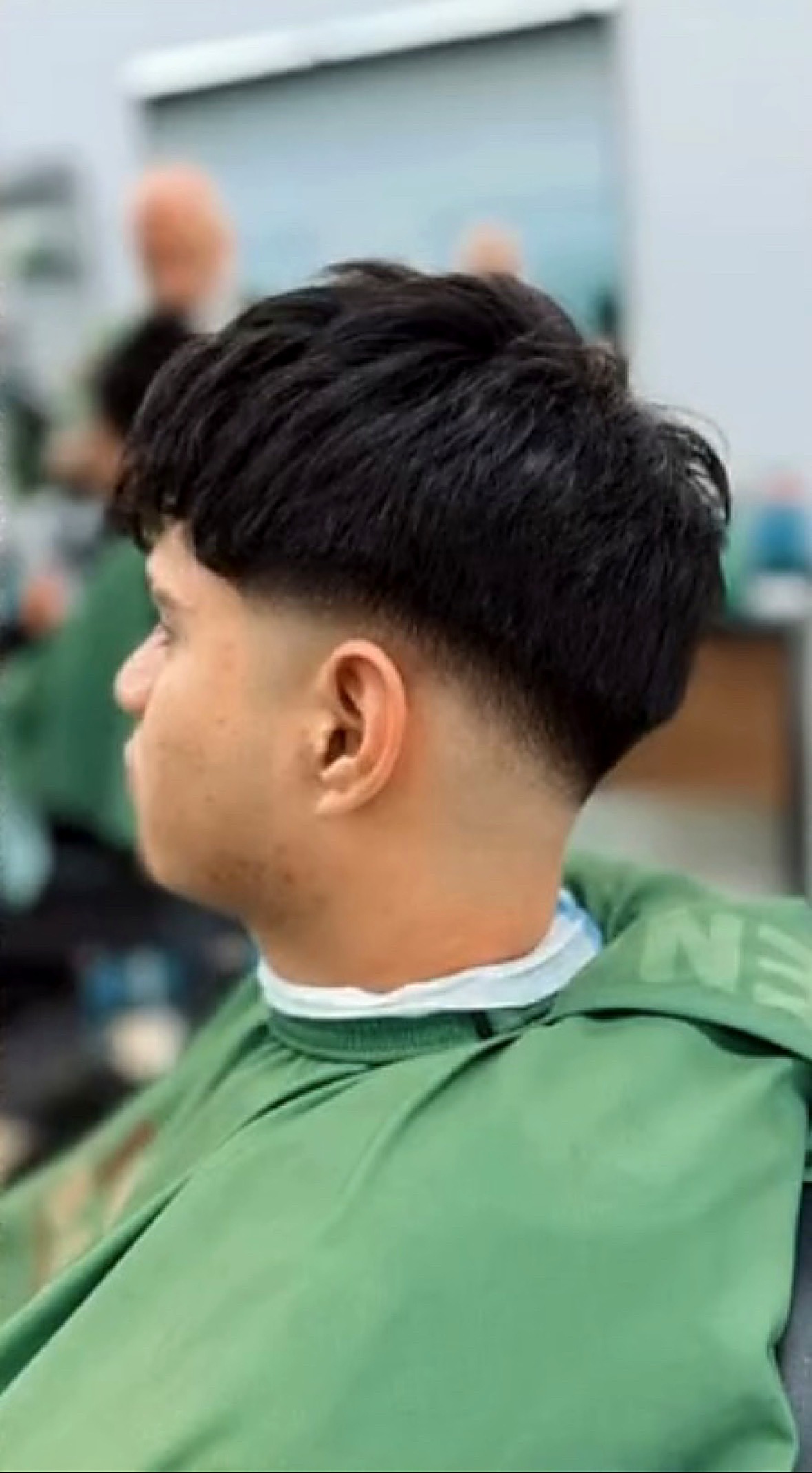 Client's fresh fade in side profile at Elevation Barbershop